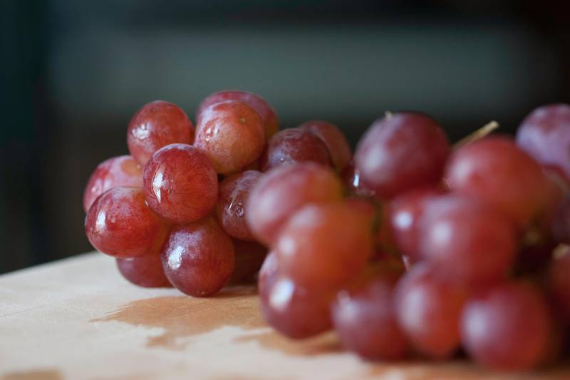 In Spain, people eat 12 grapes for good luck before the clock strikes midnight. Unsplash 