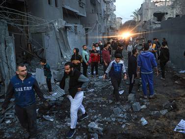 Palestinians check the damage after an Israeli strike in Rafah, in the south of the Gaza Strip. AFP