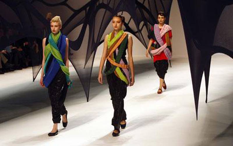 Issey Miyake (left) made several scarves do the work on one top
