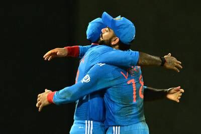 India's Virat Kohli, right, and Suryakumar Yadav celebrate after taking the wicket of Sri Lanka's Maheesh Theekshana. AFP