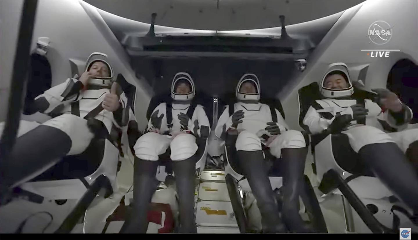 The crew of the SpaceX Dragon capsule after splashing down into the Gulf of Mexico in this image taken from NASA video. AP