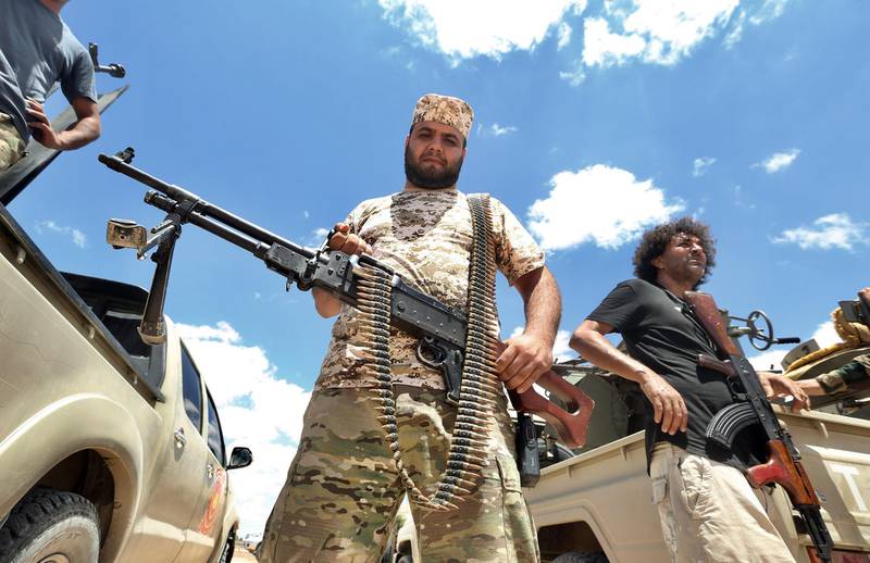 Fighters loyal to the UN-recognised Libyan Government of National Accord (GNA) secure the area of Abu Qurain, half-way between the capital Tripoli and Libya's second city Benghazi, against forces loyal to Khalifa Haftar, who is based in eastern Benghazi, on July 20, 2020. Since 2015, a power struggle has pitted the (GNA) against forces loyal to Haftar. The strongman is mainly supported by Egypt, the United Arab Emirates and Russia, while Turkey backs the GNA.
 / AFP / Mahmud TURKIA
