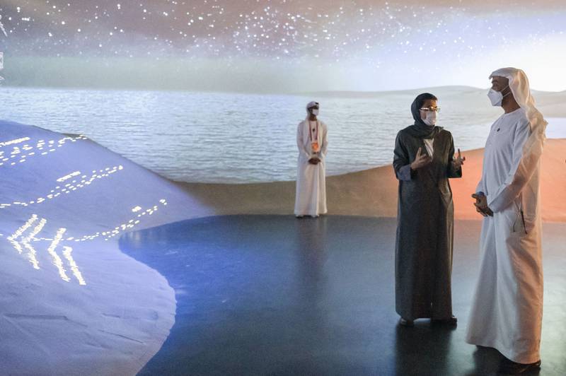 The UAE pavilion provides a stunning backdrop as Sheikh Mohamed bin Zayed, Crown Prince of Abu Dhabi and Deputy Supreme Commander of the Armed Forces, talks with Noura Al Kaabi, Minister of Culture and Youth and Commissioner General of the UAE pavilion.