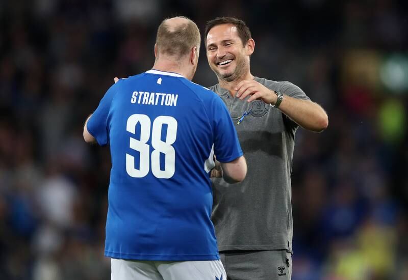 Everton fan Paul Stratton is congratulated by manager Frank Lampard. Getty