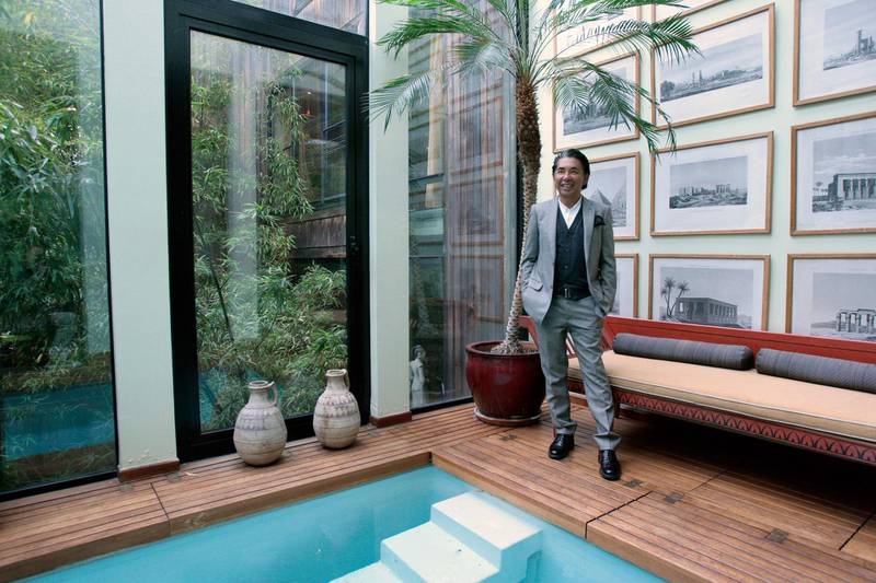 Kenzo Takada posing near the swimming pool of his loft in Paris on March 24, 2009. AFP