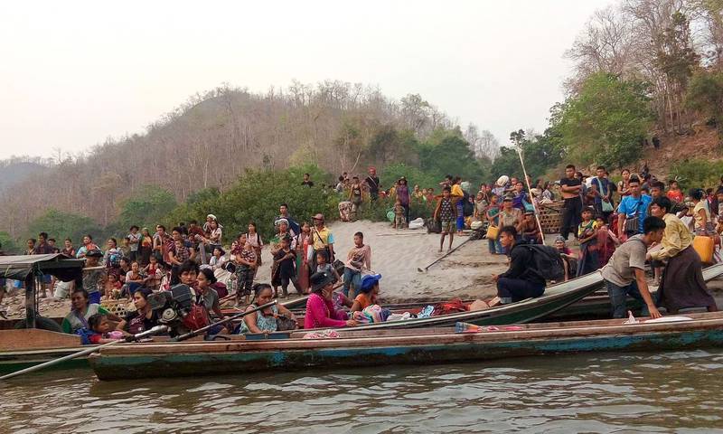 People from Karen state in Myanmar are requested by Thai authorities to head back to their country's side of the river after the military takeover in February 2021 ignited widespread violence and forced many people to flee. AFP