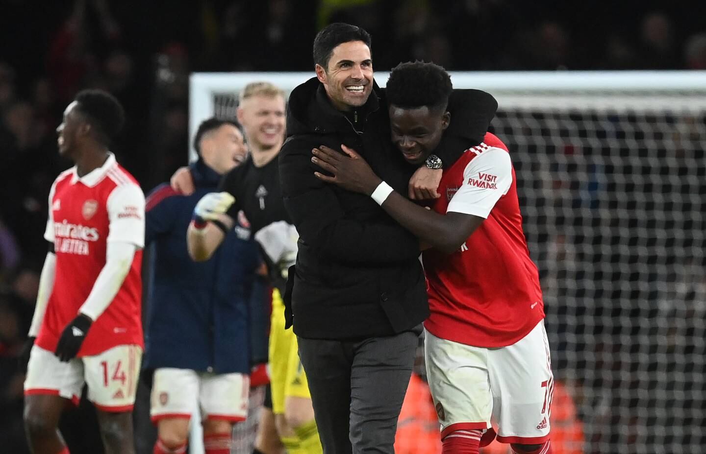 Arsenal manager Mikel Arteta and Bukayo Saka embrace after their team's victory. EPA.