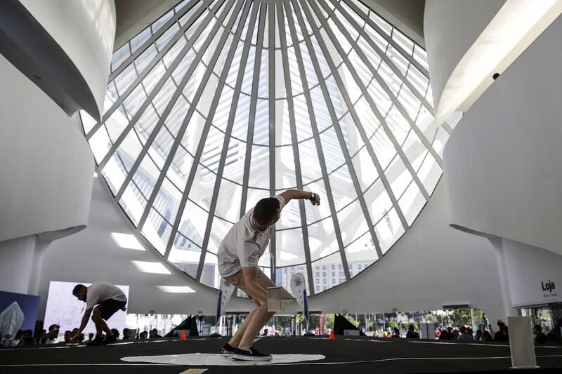 A young man throws a paper plane at the  Museum of Tomorrow during the World Paper Plane Championship, in Rio de Janeiro, Brazil, 18 April 2022.  A total of eight competitors participated, four for the longest distance modality and another equal number for the duration time in the air.  The champions will meet in Austria next May, when they will face rivals from 61 countries around the world whom they hope to overcome with their skills in the sixth edition of the World Paper Plane Championship.   EPA / Antonio Lacerda