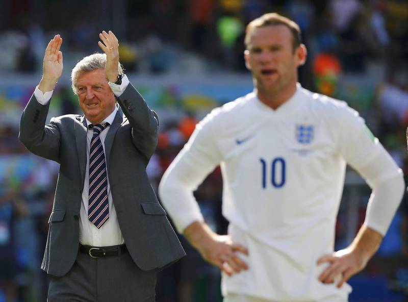 England's coach Roy Hodgson, left, applauds next to Wayne Rooney at the end of their 2014 World Cup match on Tuesday against Costa Rica in Belo Horizonte, Brazil. Damir Sagolj / Reuters