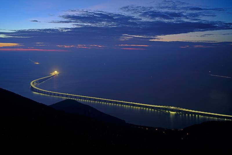Hong Kong-Zhuhai-Macau Bridge is lit up in Hong Kong. The bridge, the world's longest cross-sea project, which has a total length of 55 kilometers, will have opening ceremony in Zhuhai. AP Photo