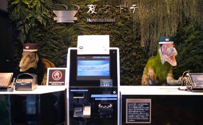 A pair of robot dinosaurs wearing bellboy hats welcome guests from the front desk at the Henn-na Hotel in Urayasu, suburban Tokyo on August. - The reception at the Henn-na Hotel east of Tokyo is eeriely quiet until customers near the robot dinosaurs manning front desk. Their sensors detect motion and they bellow: "Welcome." It might be about the weirdest check-in experience possible, but that's exactly the point at the Henn-na ("Weird") chain, which bills itself as offering the world's first hotels staffed by robots. AFP