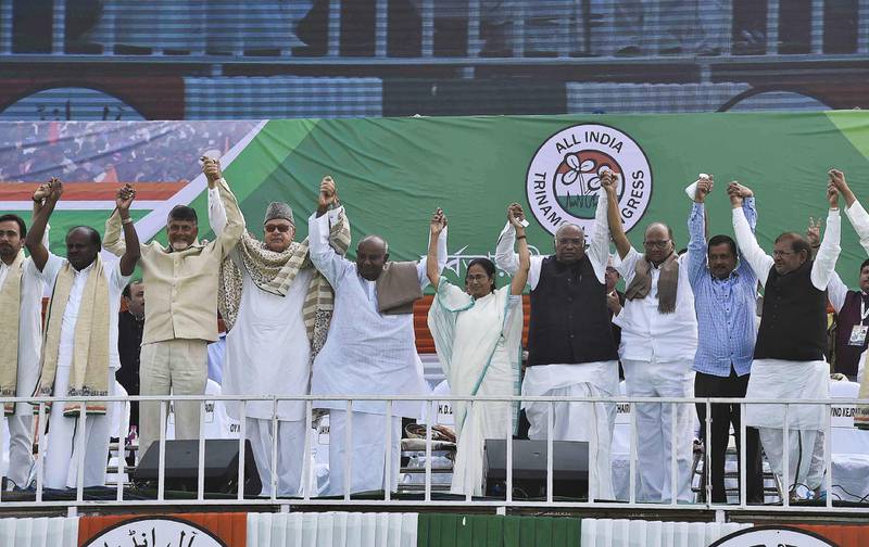 Chief minister of West Bengal state and supremo of Trinamool Congress (TMC) Mamata Banerjee (C) along with other leaders gesture during a mass meeting in Kolkata on January 19, 2019. India's opposition parties drew half a million supporters to Kolkata's streets on January 19 for the largest show of force yet against Prime Minister Narendra Modi as a national election looms. / AFP / STR
