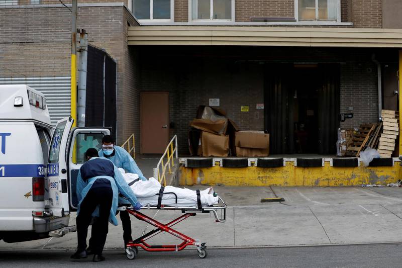 Healthcare workers load a person into an ambulance outside the Wyckoff Heights Medical Center during the outbreak of the coronavirus disease (COVID-19) in the Brooklyn borough of New York City, New York, U.S. REUTERS
