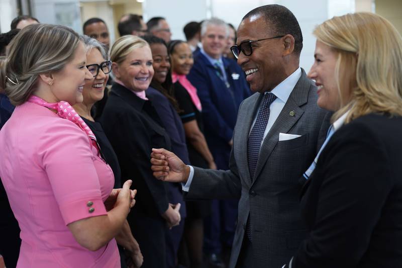Acting Federal Aviation Administration administrator Billy Nolen greets flight attendants, who will now have 10 hours between shifts, at Ronald Reagan Airport.