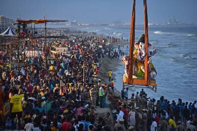 Hindu devotees gather for the immersion of the idols of elephant-headed Hindu god Lord Ganesh in Chennai. EPA
