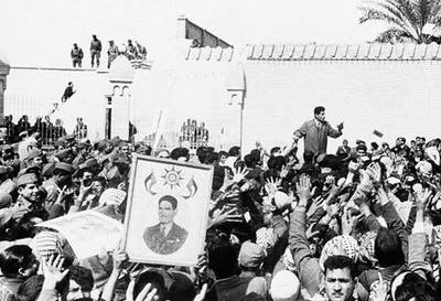 September 2, 1960: Baghdad residents rally in support of Abdel Karim Qassim, the then-Iraqi premier. Qassim, who came to power in a 1958 coup, enjoyed massive support among Iraq's large Communist movement. In 1963, Qasim was overthrown, and by 1968 Iraqi Communism was almost completely crushed.
