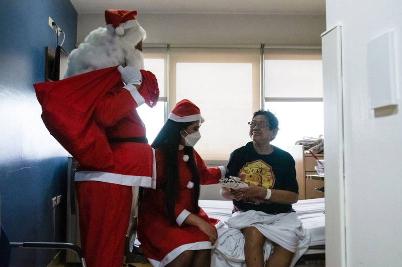 Hospital staff dressed as Santa Claus in Pasig City, Manila. AFP