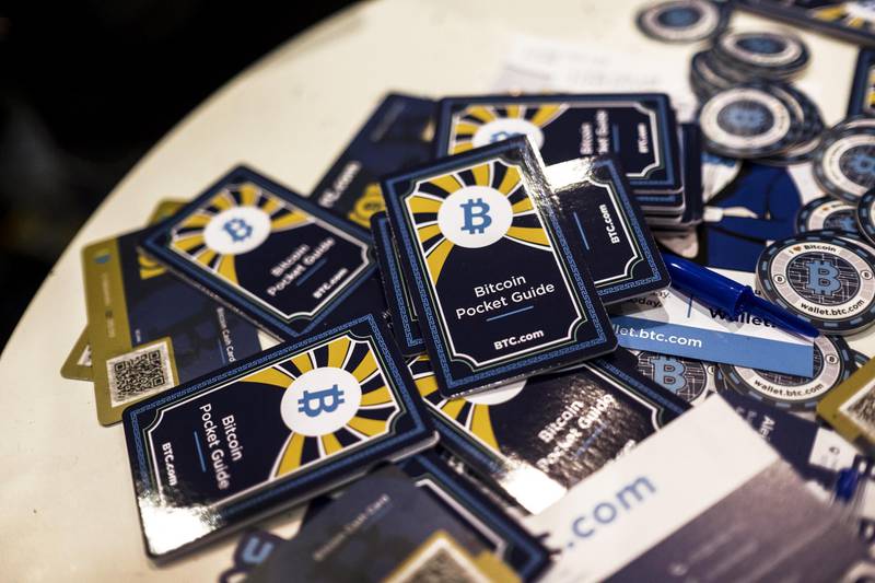 Free Bitcoin pocket information guides sit on a table at the BTC.com marketing stand at the Lisbon Web Summit in Lisbon, Portugal, on Tuesday, Nov. 7, 2017. Portugal is hoping to bolster its reputation as a startup hub in Europe at a time when political instability in Spain’s Catalonia and the U.K.’s decision to exit the European Union are triggering growing interest in the southern European country. Photographer: Daniel Rodrigues/Bloomberg