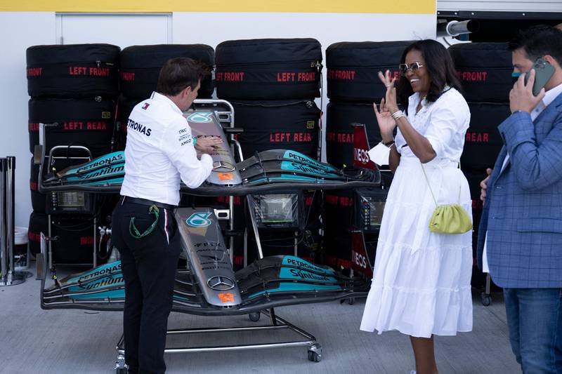Former US First Lady Michelle Obama visits the Mercedes garage. AFP