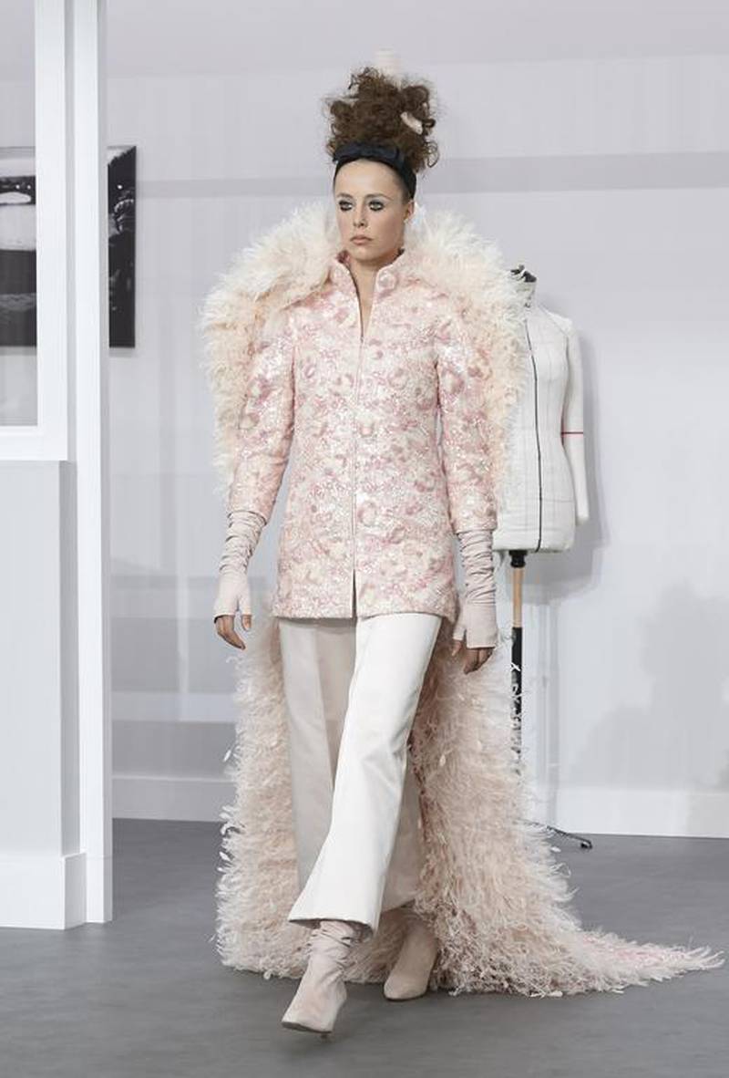 Karl Lagerfeld's bride wore a pink bustier and trousers fashioned from lace, tulle and satin, encrusted with strands of pink and white wool. Courtesy Chanel
