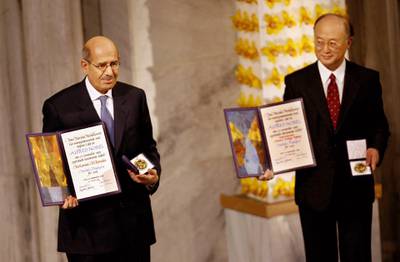 Mohamed ElBaradei, director general of the International Atomic Energy Agency (L) and Yukiya Amano, chairman of its board of governors, pose with the 2005 Nobel Peace Prize at a ceremony in the city Hall in Oslo 10 December 2005. The International Atomic Energy Agency (IAEA) and its director general Mohamed ElBaradei received the 2005 Nobel Peace Prize at a ceremony for their efforts to halt the spread of nuclear weapons.  AFP PHOTO / DANIEL SANNUM LAUTEN (Photo by DANIEL SANNUM LAUTEN / AFP)