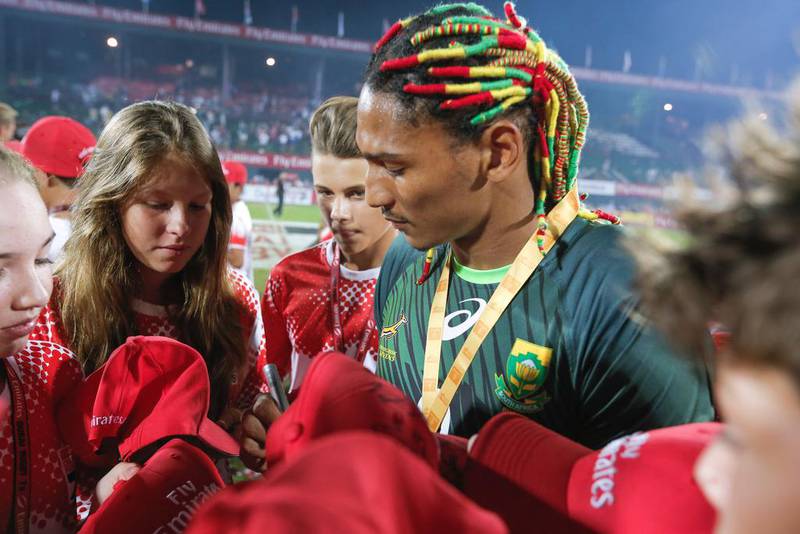 South Africa’s Justin Geduld signs caps after the match. Victor Besa for The National