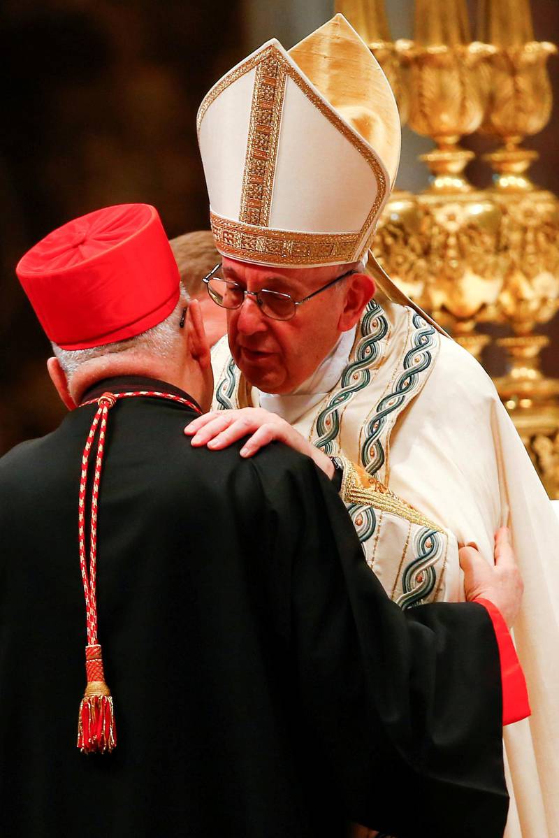 FILE PHOTO: FILE PHOTO: Pope Francis embraces new cardinal Louis Raphael I Sako of Iraq during a consistory ceremony to install 14 new cardinals in Saint Peter's Basilica at the Vatican, June 28 2018. REUTERS/Tony Gentile/File Photo/File Photo