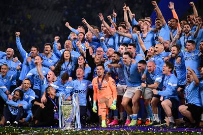 Manchester City's players pose with the European Cup trophy as they celebrate winning the UEFA Champions League final football match between Inter Milan and Manchester City at the Ataturk Olympic Stadium in Istanbul. AFP