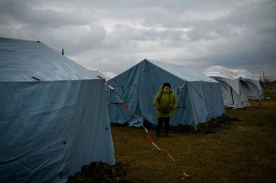 A woman in a refugee camp set up in the former football stadium of the town of Palanca, Moldova. AFP