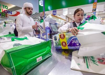 Abu Dhabi, United Arab Emirates, March 10, 2020. Lulu Hypermarket going plastic bag free and cleanliness-conscious to combat the Covid-19 outbreak.  Rashid Awad checking out using  reusable grocery bags.Victor Besa / The NationalSection:  NAReporter:  Haneen Dajani