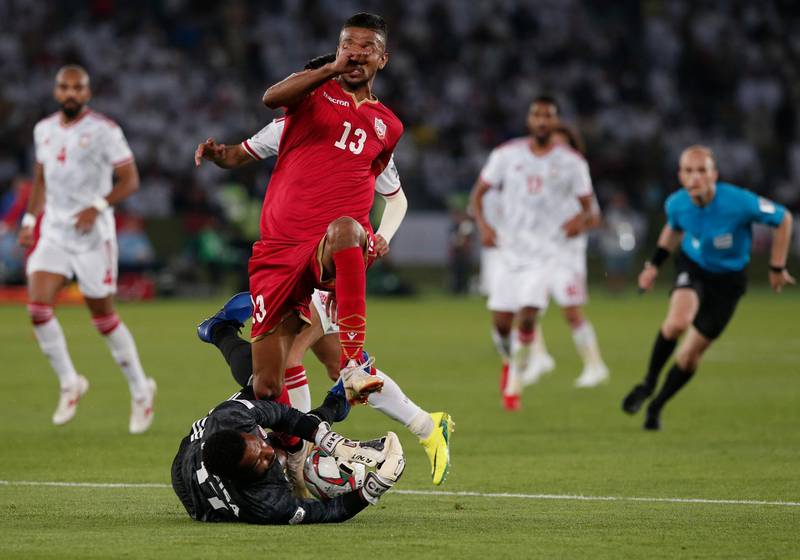 United Arab Emirates' goalkeeper Khalid Eisa saves in front of Bahrain's midfielder Jamal Rashed. AP Photo