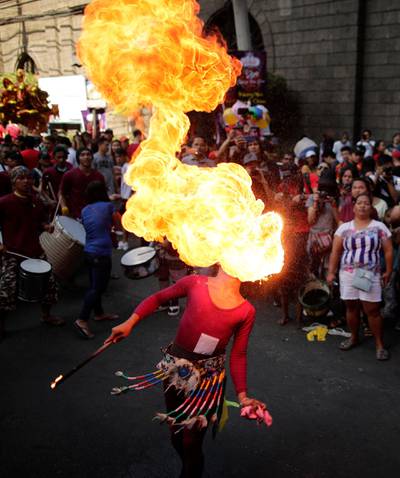 A Filipino dancer performs with fire in Manila , Philippines. EPA