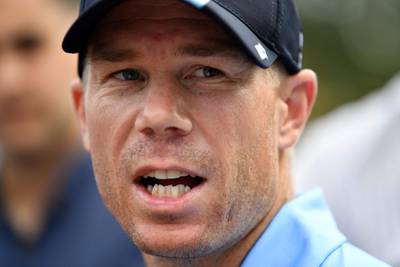 (FILES) This file photo taken on October 24, 2017 shows Australia's cricket team batsman David Warner speaking at a press conference in Sydney.  
Warner said he will undergo intense treatment on his neck after hurting it during training on November 21, 2017, just two days before the start of the first Ashes Test in Brisbane.   / AFP PHOTO / SAEED KHAN
