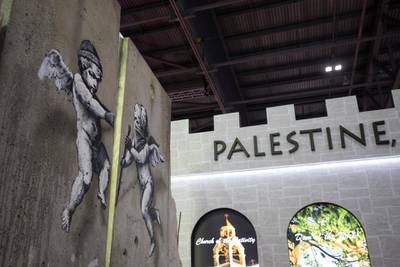 The 'replica separation barrier' created by British street artist Banksy stands. Reuters