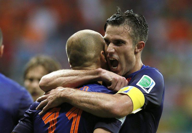 Robin van Persie and Arjen Robben embrace during Netherlands' 5-1 win over Spain at the 2014 World Cup on Friday night. Juanjo Martin / EPA