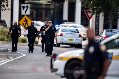Police gather after an active shooter was reported at the Jacksonville Landing. AP Photo