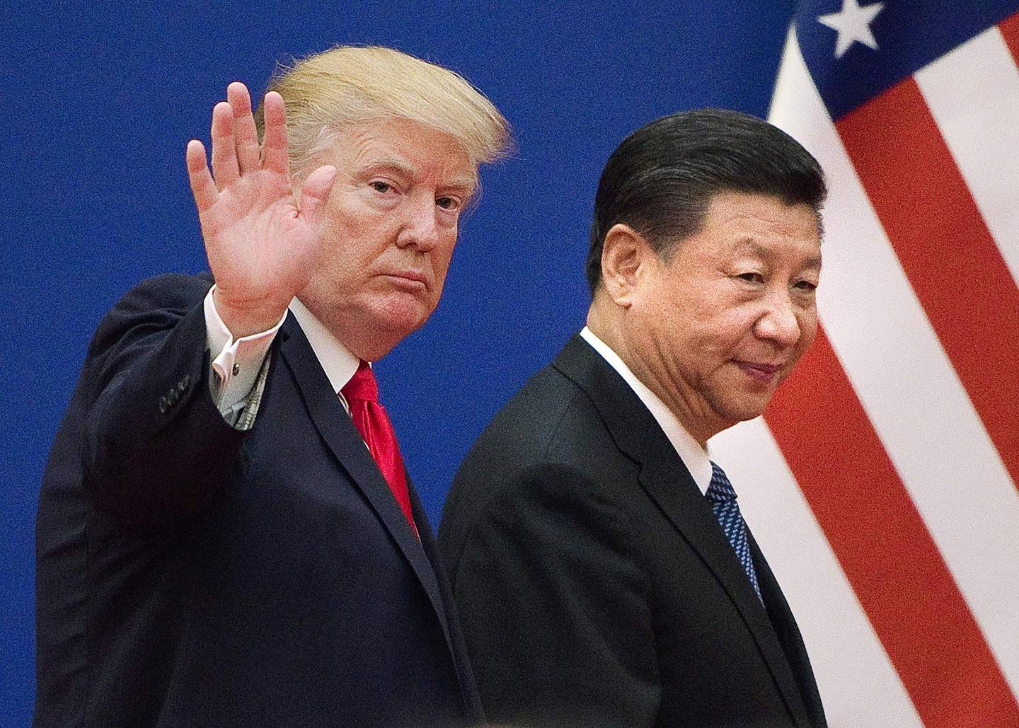 (FILES) This file picture taken on November 9, 2017, shows US President Donald Trump (L) and China's President Xi Jinping leaving a business leaders event at the Great Hall of the People in Beijing.  Trump said on December 7, 2018, the negotiations to defuse the trade conflict with China are "going very well." Trump met Xi during the G-20 summit in Buenos Aires and agreed to a 90-day tariff truce in order to find a more permanent solution to the costly dispute, but messages since have been mixed, roiling global stock markets. "China talks are going very well!" Trump tweeted. - 
 / AFP / Nicolas ASFOURI
