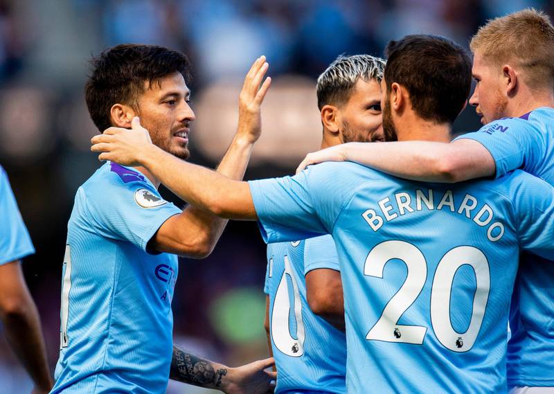 Manchester City's David Silva celebrates with teammates. AFP