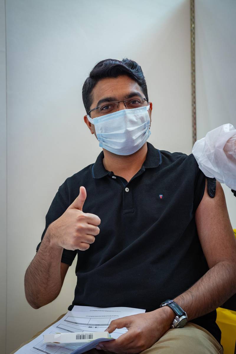 A teacher gives a thumbs up as he receives the Sinopharm shot in Abu Dhabi. Courtesy: Adek