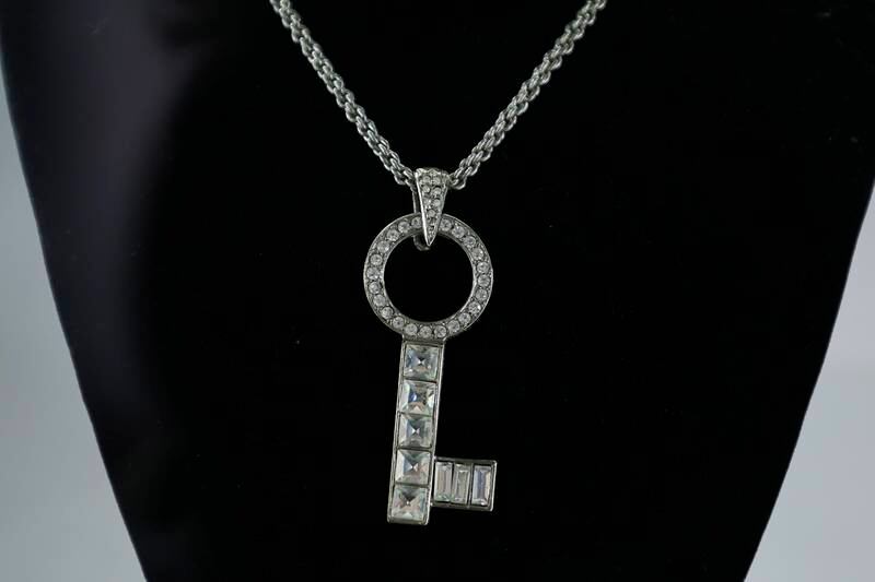 McVie's skeleton key necklace will also hit the auction block. EPA