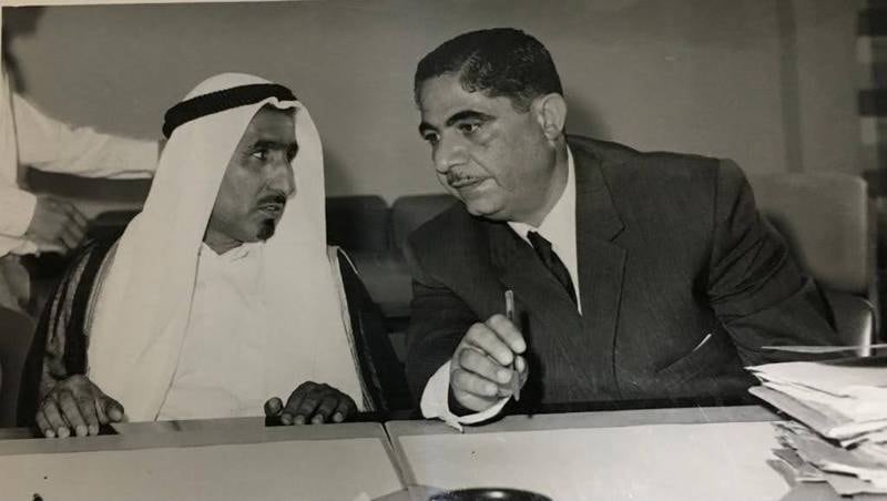 Adi Bitar, Secretary General of the Trucial States Council, in conversation with Sheikh Rashid bin Saeed Al Maktoum, Ruler of Dubai.