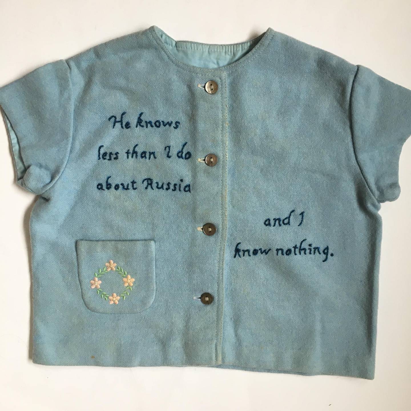 “[I] am very happy to offer [this piece] to the Tiny Pricks Project, which seems to me the right place to speak out against war," says Janet Burroway. Her son was a soldier who served in the 2003 Iraq War and took his own life after coming back to the US. Burroway has used his old baby clothes to create the piece for the project. Courtesy Tiny Pricks Project