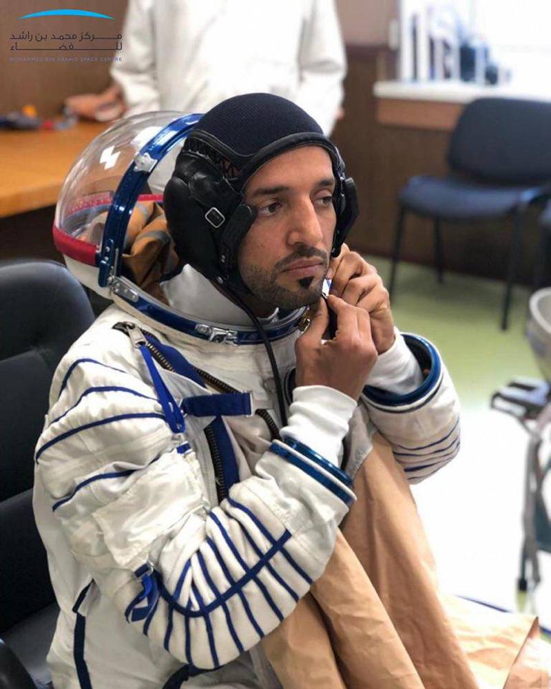 Sultan Al Neyadi puts on his custom-made space suit during a fitting at the Zvezda facility in Moscow. Courtesy Mohammed bin Rashid Space Centre