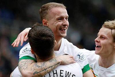 Celtic's Leigh Griffiths celebrates his goal against St Johnstone with teammates during their Scottish Premier League soccer match at McDiarmid Park Stadium in Perth, Scotland February 14, 2015. REUTERS/Russell Cheyne