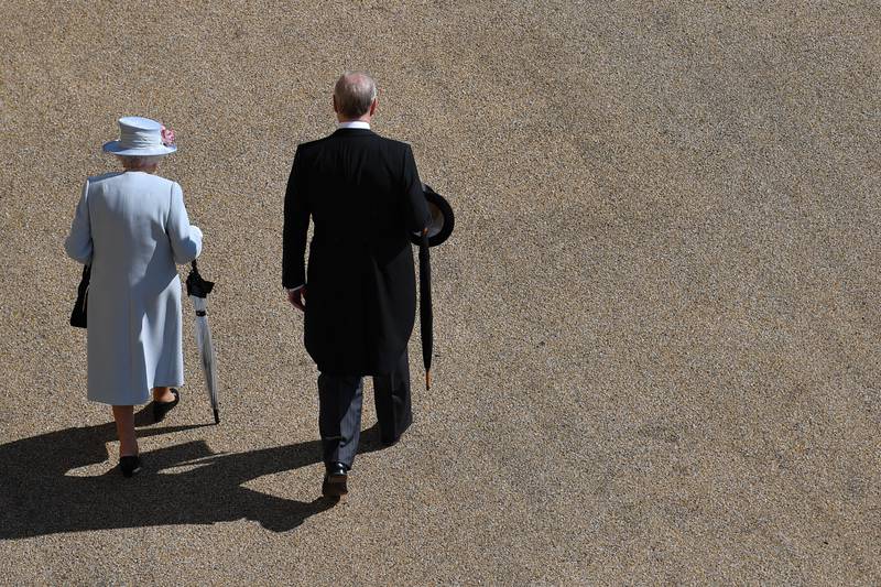 Queen Elizabeth II and Prince Andrew arrive for the Royal Garden Party at Buckingham Palace in May 2019.