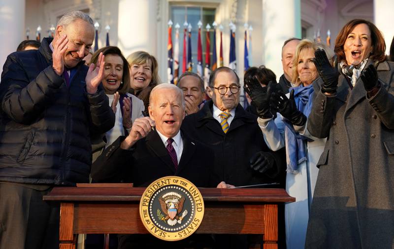 President Joe Biden celebrates signing the Respect for Marriage Act,, a landmark bill protecting same-sex marriage. Reuters