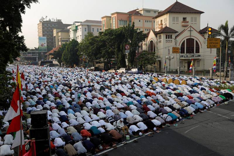 Indonesian Muslims offer Eid Al Adha prayers on a street in Jakarta, Indonesia.  Reuters