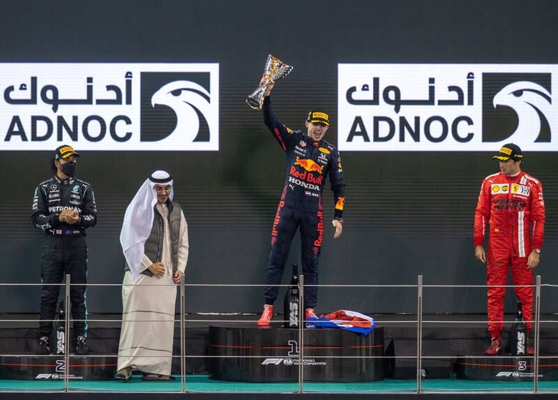 Race winner and 2021 F1 World Drivers Champion Max Verstappen of Netherlands and Red Bull Racing celebrates on the podium during the F1 Grand Prix of Abu Dhabi at Yas Marina Circui. Victor Besa/TheNational.