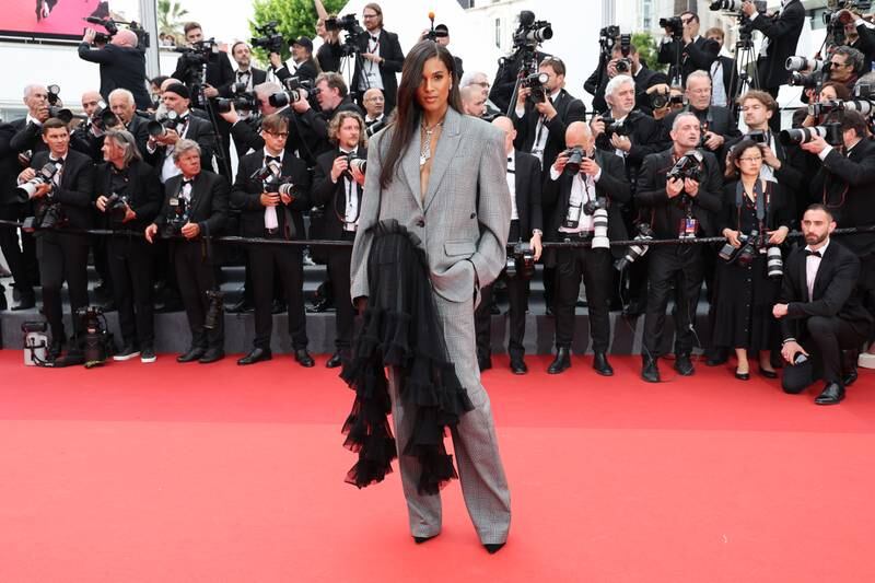 Model Cindy Bruna wears a suit by Act N°1, with Pomellato jewellery. Getty