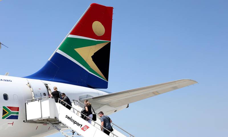 FILE PHOTO: Passengers board a South African Airways plane at the Port Elizabeth International Airport in the Eastern Cape province, South Africa, September 30, 2018. REUTERS/Siphiwe Sibeko/File Photo